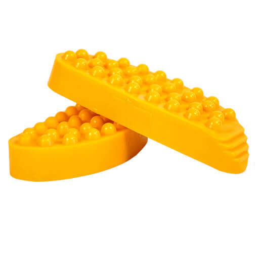 Yellow hoof blocks for milking cows, featuring skid-resistant design, by Lauren AgriSystems. Ideal for dairy farms and cows